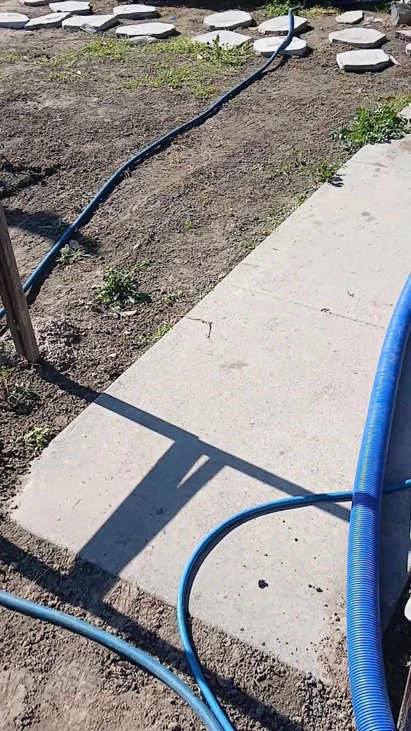 Professional cleaning hose prepared at a Fresno property
